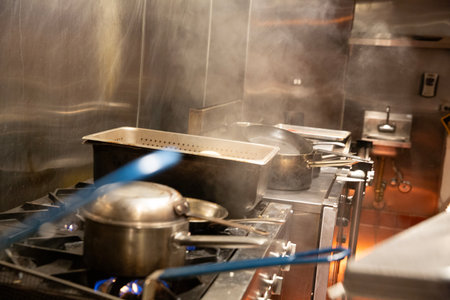 Chef cooking food in the kitchen of a restaurant or hotel.の写真素材