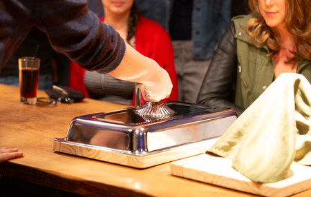 Close-up of waiter making a drink in a bar.の写真素材