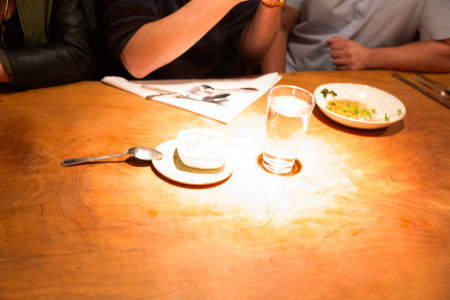 Restaurant table with menu and food in restaurant, stock photoの写真素材