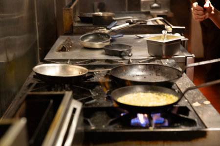 Chef at work in a restaurant kitchen. Chef cooking food.の写真素材