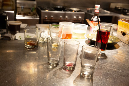 Set of shot glasses on the counter of a restaurant, selective focusの写真素材