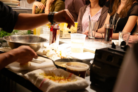 Hands of chefs preparing food in the kitchen of a restaurant.の写真素材
