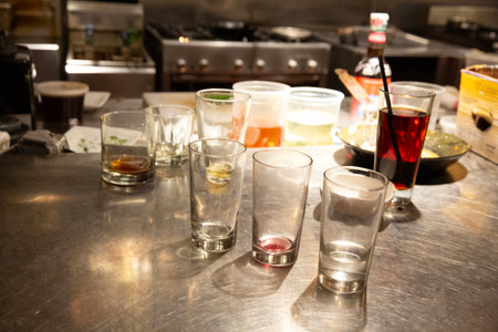 Alcoholic drinks on a bar counter in a pub or restaurantの写真素材