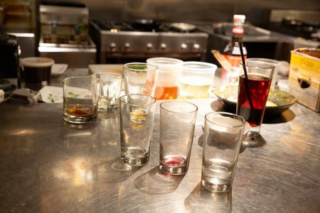 Empty shot glasses on the bar counter in a restaurant, stock photoの写真素材