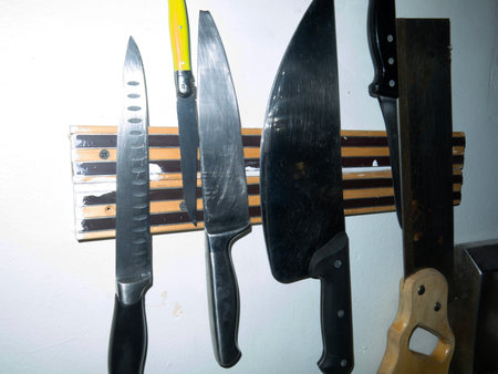 Kitchen knives on shelf, closeup of photo, local focusの写真素材
