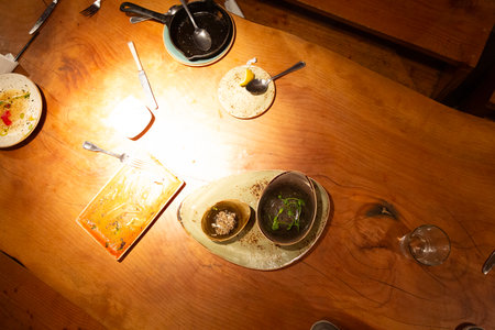 Restaurant table with food and drink. Food styling and restaurant meal serving.の写真素材