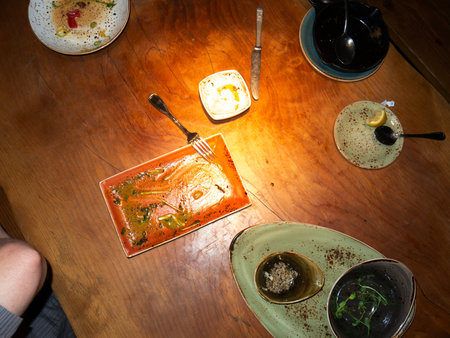 Top view of a table in a restaurant with food and drinks.の写真素材