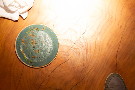 Empty blue plate on a wooden table, top view, copy spaceの写真素材