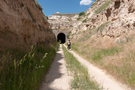 Walking through a tunnel in the middle of the desert in summerの写真素材