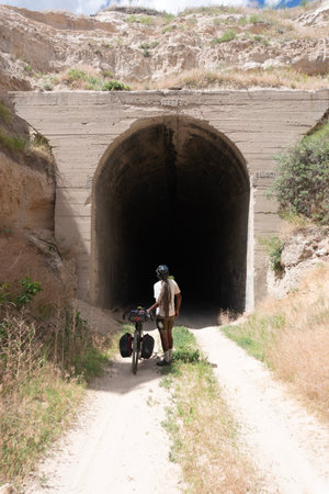Tunnel in the middle of the road to the village of Cusco, Peruの写真素材