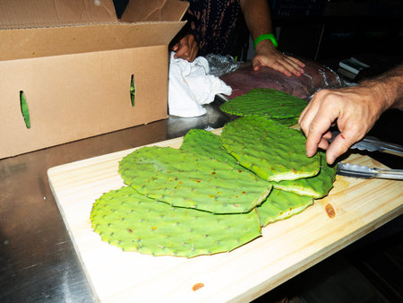 Prickly pear cactus with slices on a cutting board.の写真素材