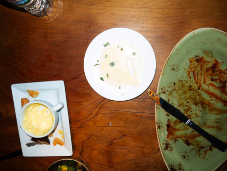 Dirty dishes on the table in a restaurant. Top view.の写真素材