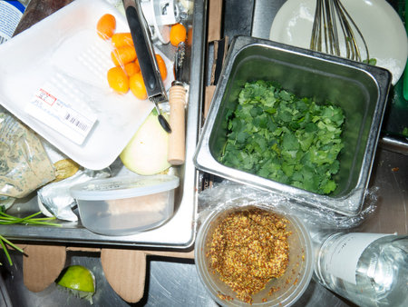 preparation of vegetable salad in the kitchen, close-upの写真素材