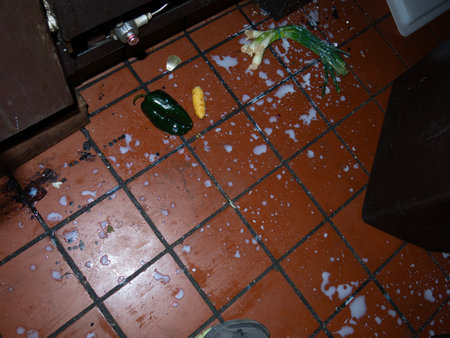 Dirty kitchen floor with dirty food in the morning, stock photoの写真素材