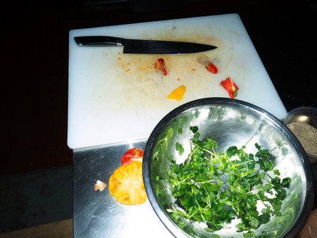 Preparation of vegetable salad on a cutting board in the kitchen