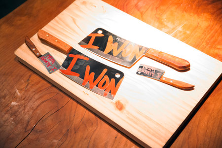 A set of kitchen knives on a wooden cutting board