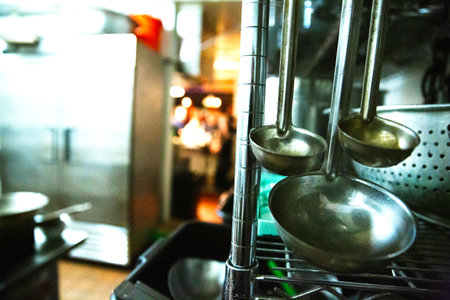 stainless steel ladle in restaurant kitchen with blur background.の写真素材