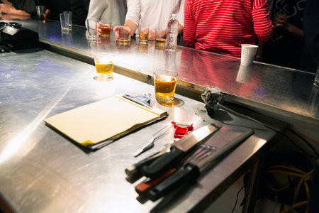 Barman preparing a cocktail at the bar counter in a nightclub.の写真素材