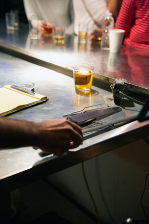 Barman serving pint of beer at bar counter in pub or pubの写真素材