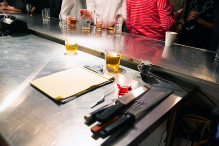 Barman making a cocktail at the bar counter in a nightclub.の写真素材