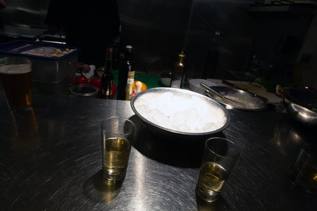 Cocktail on the bar counter in a restaurant. Barman's hands.の写真素材