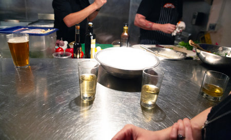 Chef preparing a meal in a restaurant kitchen, close-upの写真素材