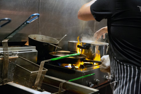 Chef cooking food in a restaurant kitchen. Chef cooking food.の写真素材