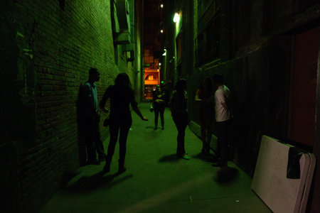 People walking in the street at nightの写真素材