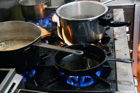 Cooking on a gas stove in a restaurant kitchen. Cooking foodの写真素材