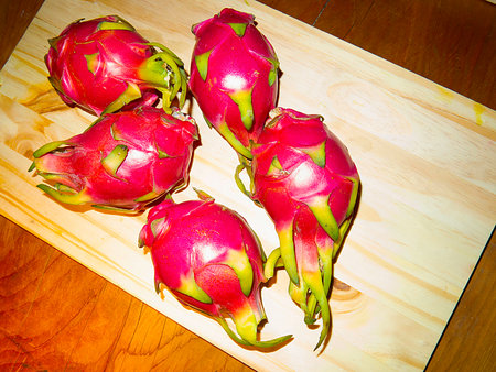 Dragon fruit on wooden cutting board. Tropical fruit. Healthy food.の写真素材