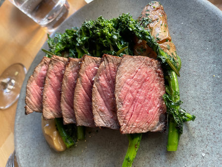 Grilled beef with kale and asparagus on a plate.の写真素材