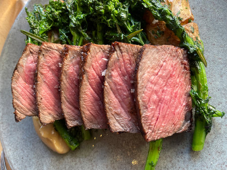 Sliced roast beef with asparagus on a plate.の写真素材
