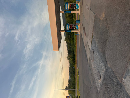 Aerial view of a gas station on a sunny day with blue skyの写真素材