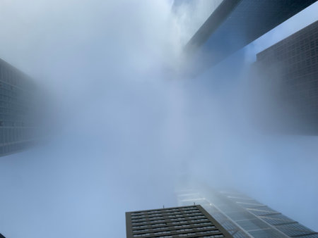 Smoke from the chimney of an office building in Hong Kongの写真素材