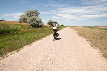 Cyclist riding on a dirt road in the countryside of Spainの写真素材