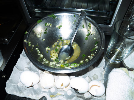 Boiled eggs in a saucepan on the table in the kitchenの写真素材