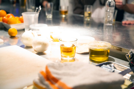 Barman preparing a cocktail at the bar counter in a restaurant.の写真素材