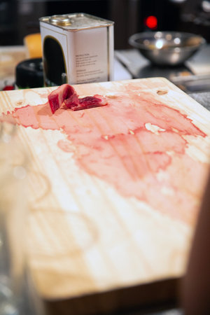 Cutting beef on a cutting board in a restaurant. Selective focus.の写真素材