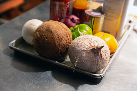 coconut and vegetables on the table in the kitchen of the restaurantの写真素材
