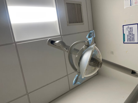 Watering can in the public toilet, closeup of photo.の写真素材