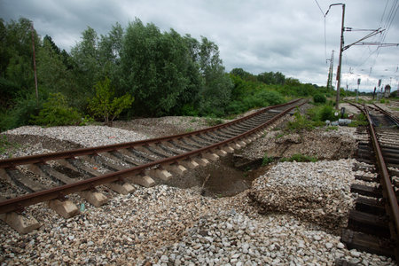 Railway tracks on a cloudy day in the village. Landscape.の写真素材