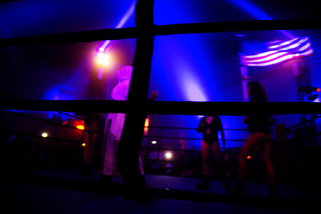 Boxing ring in the night club. Silhouette of a boxerの写真素材
