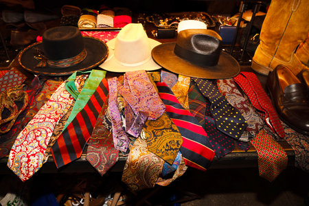 Hats, neckties and hats for sale at a flea marketの写真素材
