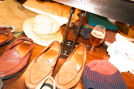 Shoes and hats on a shelf.の写真素材