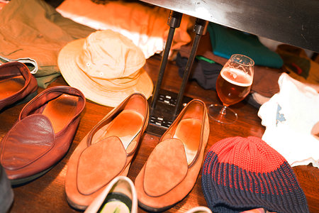 Close up of a man's hand choosing a pair of shoes.の写真素材