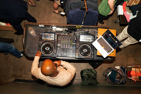 Bartender serving two glasses of beer at bar counter in pubの写真素材