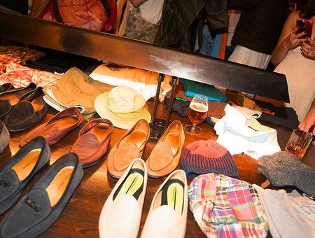 Unidentified Thai people sell shoes in a market.の写真素材