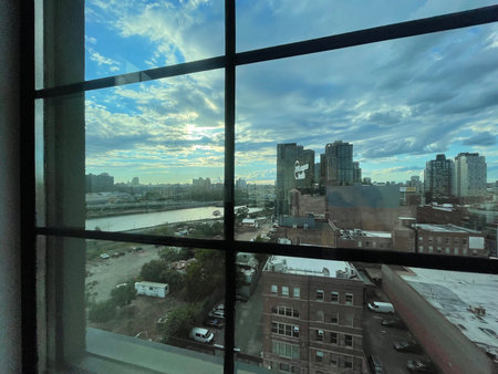 View from the window to the city and the sky with clouds.の写真素材