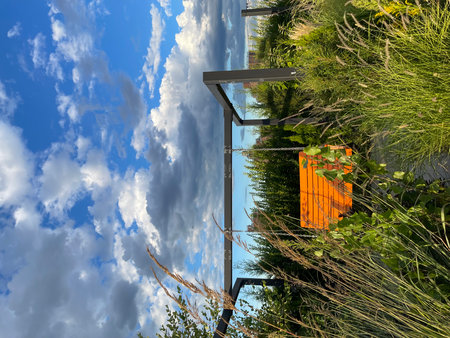 Detail of a balcony with a view of the sky and cloudsの写真素材