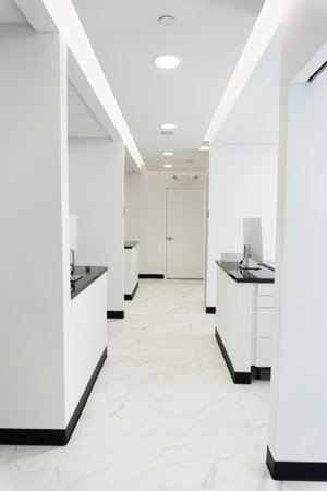 Interior of a modern bathroom with white walls and marble floorの写真素材